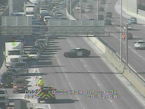 Traffic is redirected following a crash on the Queensway Saturday morning.