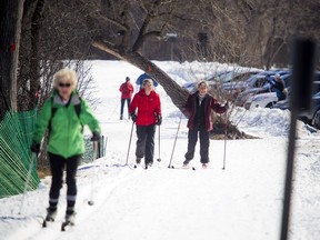 Cross-country skiers made their way down the groomed multi-use winter trail along the Sir John A. Macdonald Parkway near the Island Park Bridge Saturday March 18, 2017.