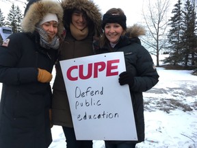 From left, teaching assistants Marie Maxime, Diana Hiebert and Elise Bigley joined the picket line set up at Carleton University for about an hour on Monday morning.