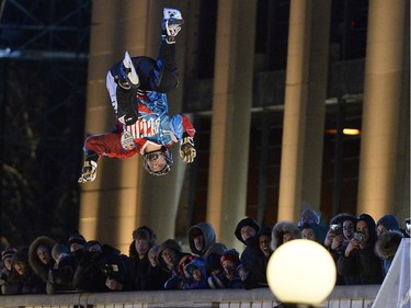 Russia's Denis Novozhilov does a flip during the freestyle competition at the Red Bull Crashed Ice world championship, in Ottawa on Friday, March 3, 2017.