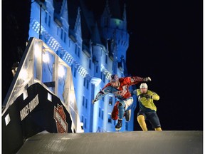 Russia's Dmitry Murlichkin, left, leads Finland's Janne-Petteri Mynttinen during qualifiers at the Red Bull Crashed Ice world championship, in Ottawa on Friday, March 3, 2017.