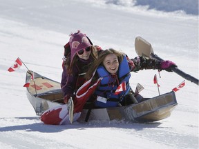 Evelyn and Mirabel Gray race in their Canada Canoe during the Camp Fortune Cardboard Sled Derby on Saturday, March 25, 2017.