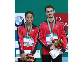 BEIJING, CHINA - MARCH 04: Bronze medallist Francois Imbeau-Dulac and Jennifer Abel of Canada poses during the medal ceremony for the Mixed 3m Synchro Springboard final on day two of the FINA/NVC Diving World Series 2017 Beijing Station at the National aquatics center-Water Cube on March 4, 2017 in Beijing, China.