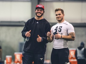 Calgary Stampeders linebacker Alex Singleton, left, tags along for brother Matt Singleton's CFL Draft Combine workout on Saturday in Regina. JOHANY JUTRAS/CFL