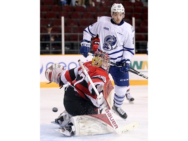 Goalie Leo Lazarev lets in a goal as Jacob Cascagnette looks for a rebound in the second period as the Ottawa 67's take on the Mississauga Steelheads in game 4 of Ontario Hockey League playoff action at TD Place Arena.