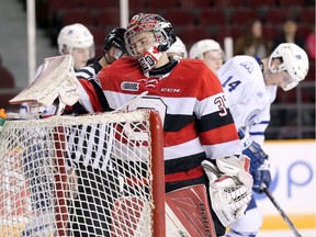 Goalie Leo Lazarev looks dejected after giving up the fourth goal in the second period as the Ottawa 67's take on the Mississauga Steelheads in Game 4 of Ontario Hockey League playoff action at TD Place Arena.