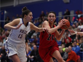 Victoria's Jenna Bugiardini can't stop Carleton's Elizabeth Leblanc as she drives to the basket during the second half of Thursday's game. The Ravens won 77-66.