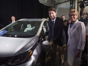 Prime Minister Justin Trudeau and Premier Kathleen Wynne at a Ford even in Windsor which included an announcement that Ford will spend as much as $337.9 million on a new research and development centre in Ottawa that will focus on developing self-driving vehicles.