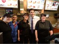 Prime Minister Justin Trudeau poses for photos with staff the Tim Horton's coffee shop in the Student Union Building at Bishop's University in Sherbrooke, Quebec on Wednesday January 18, 2017.
