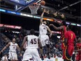 Carleton's Kaza Kajami-Keane scores against Calgary during the first half of Thursday's quarterfinal game. The Ravens won 85-69.