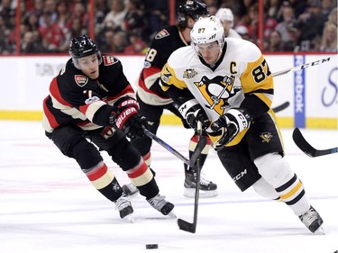 Ottawa Senators' Kyle Turris (7) chases Pittsburgh Penguins' Sidney Crosby (87) during first period NHL hockey action in Ottawa, Thursday March 23, 2017.
