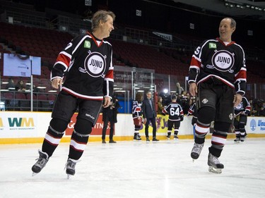 L-R Jim Cuddy laughs with Barney Bentall at TD Place arena Thursday March 30, 2017 during the practice skate a day before the big Juno Cup hockey game.