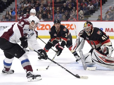 Ottawa Senators goalie Craig Anderson (41) watches Colorado Avalanche's Matt Duchene (9) drive towards the net as Ottawa Senators Marc Methot (3) looks on during first period NHL hockey action in Ottawa, Thursday, March 2, 2017.