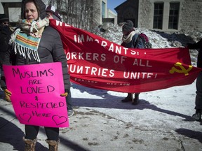 Melissa Newitt braved the cold weather to take part in the Counter Rally Against Ottawa Islamophobes organized by the Ottawa Against Fascism group in front of city hall near the Human Rights Monument.