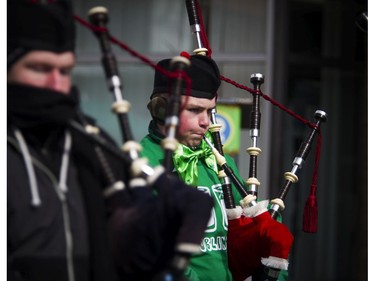 Members of the Ottawa Caledonian Pipes and Drums braved the cold for the 35th Annual St. Patrick's Parade took Saturday March 11, 2017.   Ashley Fraser/Postmedia
