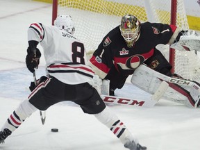 Chicago Blackhawks centre Nick Schmaltz tries to put the puck past Ottawa Senators goalie Mike Condon during first period NHL action, in Ottawa on Thursday, March 16, 2017.