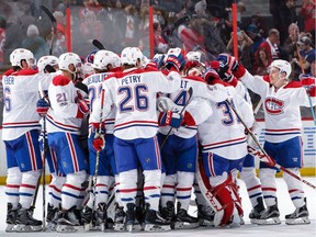 Canadiens players celebrate Saturday's shoot-out victory against the Senators at Canadian Tire Centre.