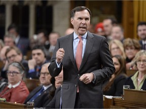 Finance Minister Bill Morneau answers questions about the budget Thursday, with the prime minister absent from the chamber.
