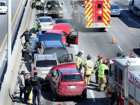 While dramatic looking there were no serious injuries in this multi-car crash that blocked two lanes of the eastbound Queensway and backed cars up for kilometres.