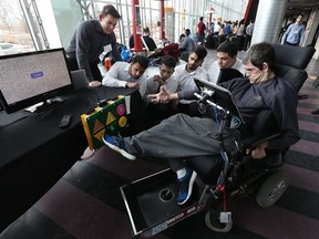 Jorge de Almeida tests out a new foot-controlled remote control TV remote at the University of Ottawa in Ottawa Wednesday March 29, 2017.