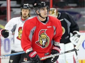 Newly acquired Alex Burrows (#14) on the ice during practice.