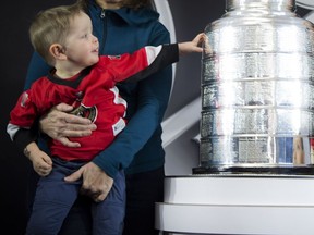 Lucas Mann, 2, gets an opportunity to get up close and personal with the Stanley Cup at the Aberdeen Pavilion on Satuday. Lucas was there for the NHL Centennial Fan Arena with his brother Weston, 4.   Ashley Fraser/Postmedia