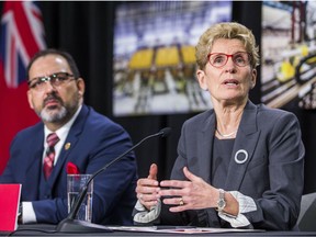 Ontario Premier Kathleen Wynne, along with Ontario Energy Minister Glenn Thibeault announce cuts to hydro rates on average of 25 per cent during a press conference in Toronto, Ont. on Thursday March 2, 2017. Ernest Doroszuk/Toronto Sun/Postmedia Network