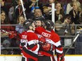 Ottawa 67's L-R #13 Artur Tyanulin, #9 Austen Keating and #93 Mathieu Foget celebrate after the first goal of the game against the Hamilton Bulldogs Sunday March 19, 2017 at TD Place Arena.