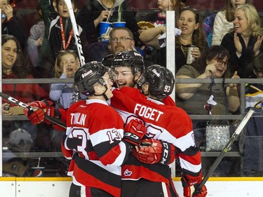 Ottawa 67's L-R #13 Artur Tyanulin, #9 Austen Keating and #93 Mathieu Foget celebrate after the first goal of the game against the Hamilton Bulldogs Sunday March 19, 2017 at TD Place Arena.   Ashley Fraser/Postmedia