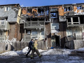 Ottawa Fire Services Investigators on the scene at 34 Northview Road where a fire affected 52 units and displaced as many as 70 people. March 13,2017.