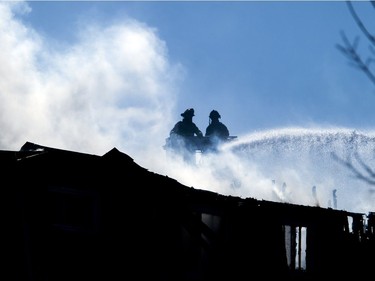 Ottawa firefighters were battling a four-alarm blaze in the Baseline-Merivale area at 34 Northview Rd., a strip of rowhouse apartments Saturday March 12, 2017.