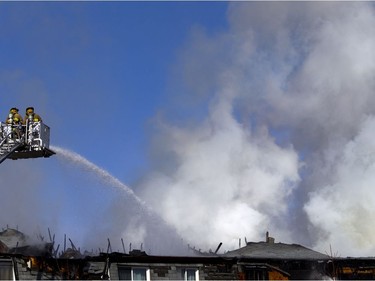 Ottawa firefighters were battling a four-alarm blaze in the Baseline-Merivale area at 34 Northview Rd., a strip of rowhouse apartments Saturday March 12, 2017.