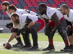J'Micheal Deane, second from right, lines up with teammates during a Redblacks practice at TD Place stadium on Oct. 17, 2016. Errol McGihon/Postmedia