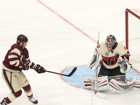 Wearing the O logo jersey in a 2014 Heritage Classic game at Vancouver, Senators goalie Craig Anderson blocks a shot by Vancouver's Brad Richardson during the second period. Carmine Marinelli/Vancouver 24hours/QMI Agency