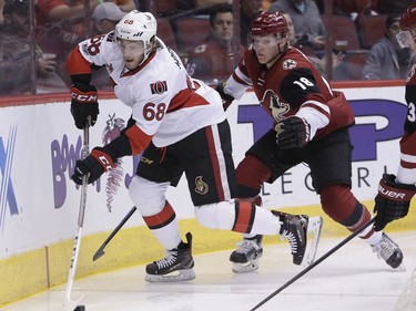 Ottawa Senators left wing Mike Hoffman (68) skates away from Arizona Coyotes center Christian Dvorak during the first period of an NHL hockey game, Thursday, March 9, 2017, in Glendale, Ariz.