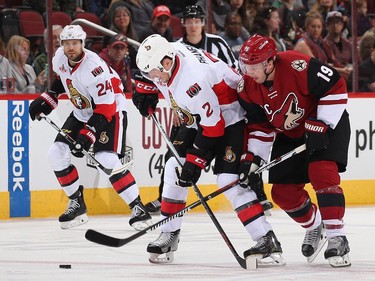 GLENDALE, AZ - MARCH 09:  Dion Phaneuf #2 of the Ottawa Senators and Shane Doan #19 of the Arizona Coyotes battle for the puck during the first period of the NHL game at Gila River Arena on March 9, 2017 in Glendale, Arizona.