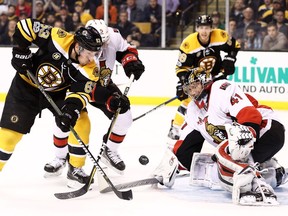 Boston's Brad Marchand takes a shot against Ottawa netminder Craig Anderson during the third period of the game at TD Garden.