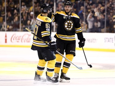 BOSTON, MA - MARCH 21: David Krejci #46 of the Boston Bruins celebrates with Ryan Spooner #51 after scoring against the Ottawa Senators  the first period at TD Garden on March 21, 2017 in Boston, Massachusetts.