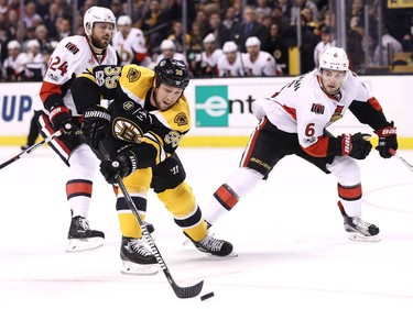 BOSTON, MA - MARCH 21: Matt Beleskey #39 of the Boston Bruins skates against Chris Wideman #6 of the Ottawa Senators during the first period at TD Garden on March 21, 2017 in Boston, Massachusetts.