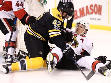 BOSTON, MA - MARCH 21: David Backes #42 of the Boston Bruins and Dion Phaneuf #2 of the Ottawa Senators fight during the first period at TD Garden on March 21, 2017 in Boston, Massachusetts.