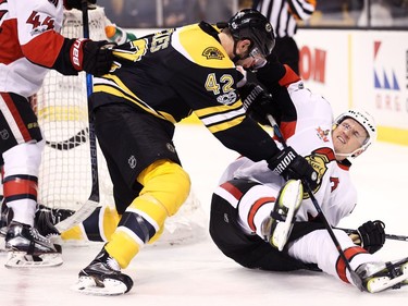 BOSTON, MA - MARCH 21: David Backes #42 of the Boston Bruins and Dion Phaneuf #2 of the Ottawa Senators fight during the first period at TD Garden on March 21, 2017 in Boston, Massachusetts.