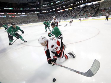 DALLAS, TX - MARCH 08:  Mark Borowiecki #74 of the Ottawa Senators is checked by Brett Ritchie #25 of the Dallas Stars in the first period at American Airlines Center on March 8, 2017 in Dallas, Texas.