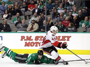 Jean-Gabriel Pageau #44 of the Ottawa Senators skates the puck against John Klingberg #3 of the Dallas Stars in the second period at American Airlines Center on March 8, 2017 in Dallas, Texas.