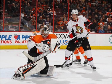 PHILADELPHIA, PA - MARCH 28: Steve Mason #35 of the Philadelphia Flyers makes the first period save as Mark Stone #61 of the Ottawa Senators looks for the rebound at the Wells Fargo Center on March 28, 2017 in Philadelphia, Pennsylvania.