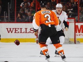 Radko Gudas of the Philadelphia Flyers goes after Mark Borowiecki of the Ottawa Senators following a first-period hit at the Wells Fargo Center on March 28, 2017.