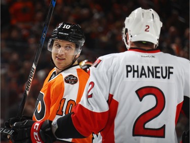 PHILADELPHIA, PA - MARCH 28: Brayden Schenn #10 of the Philadelphia Flyers talks to Dion Phaneuf #2 of the Ottawa Senators during a second period play stoppage at the Wells Fargo Center on March 28, 2017 in Philadelphia, Pennsylvania.