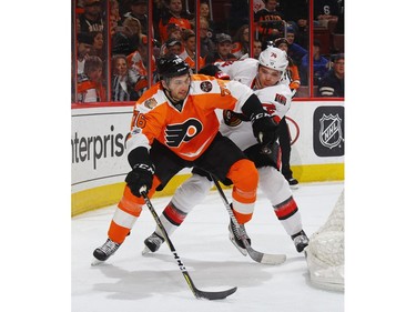 PHILADELPHIA, PA - MARCH 28: Chris VandeVelde #76 of the Philadelphia Flyers carries the puck past Mark Borowiecki #74 of the Ottawa Senators during the second period at the Wells Fargo Center on March 28, 2017 in Philadelphia, Pennsylvania.