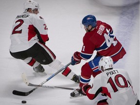 Montreal's Paul Byron squeezes between Ottawa's Dion Phaneuf and Tom Pyatt a Nov. 22 game in Montreal. The Canadiens and Senators meet three times in the next eight days.