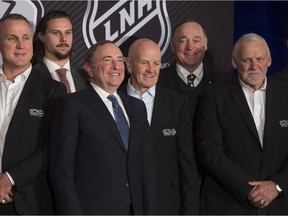 Bernie Parent, far right, joins the group posing at the outdoor game announcement on Friday. Also in the shot, from left to right, are Paul Coffey, Erik Karlsson, NHL commissioner Gary Bettman, Dave Keon and Frank Mahovlich.