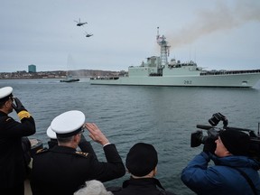 Vice Admiral Ron Lloyd, Commander of the Royal Canadian Navy (RCN) and Commander Maritime Forces Atlantic (MARLANT) Rear Admiral John Newton take a salute as Her Majesty's Canadian Ship (HMCS) ATHABASKAN perfoms a final sail past on 10 March 2017 in Halifax, Nova Scotia. 
 
Photo: Master Corporal C.A. Stephen, Formation Imaging Services Halifax